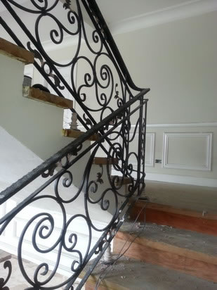 Wrought Iron Stair Railing, Entrance Gate, and False Balcony Railing