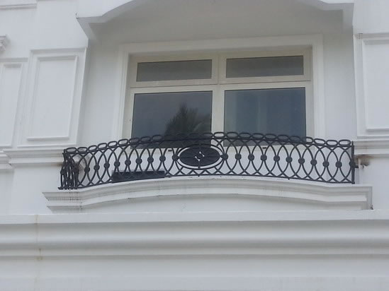 Wrought Iron Stair Railing, Entrance Gate, and False Balcony Railing