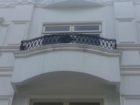 Wrought Iron Stair Railing, Entrance Gate, and False Balcony Railing