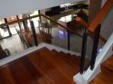 Glass Modern Stair Railing in Wrought Iron Frame