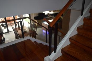 Glass Modern Stair Railing in Wrought Iron Frame